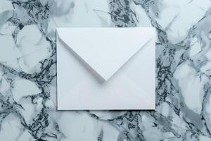White blank envelope on gray marble table background. Top view photo