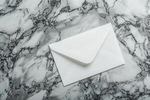 White blank envelope on gray marble table background. Top view photo