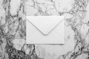 White blank envelope on gray marble table background. Top view photo