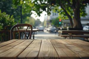 Empty natural wood table top in outdoors terrace, cafe. Empty backdrop on empty wooden table for food, drink, product with city street background photo