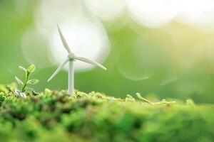 Miniature wind farm with tiny turbines in green fields. Renewable energy and sustainability. Clean energy and net zero emissions concept. Sustainable energy, renewable resources, and carbon neutrality photo