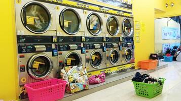 Semarang, Indonesia - May, 2024 - washing machines are lined up in the laundry area photo