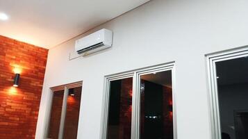 a room with a window. lights and air conditioning photo