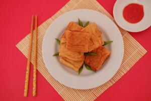 Tahu Bakso, Indonesian traditional snack made from tofu and beef. Served in white plate. photo