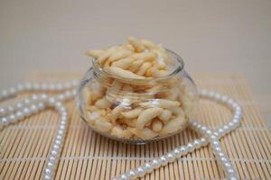 telur gabus sticks in a jar on wooden table background. photo