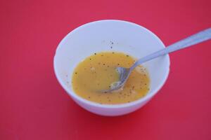 bowl with stirred raw eggs as a background photo