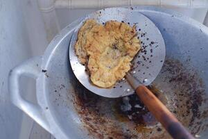 Fried omelet in a frying pan, close-up photo