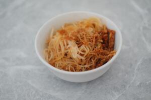 Fried vermicelli noodles in white bowl background photo