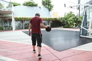 Man playing basketball photo