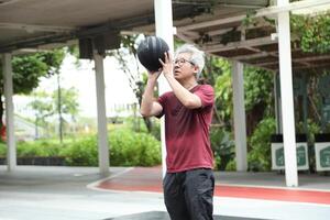 Man playing basketball photo
