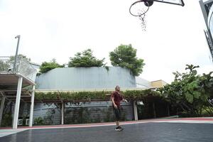Man playing basketball photo