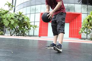 Man playing basketball photo