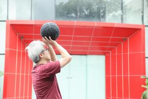 Man playing basketball photo