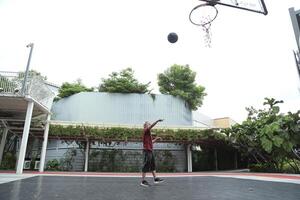 Man playing basketball photo
