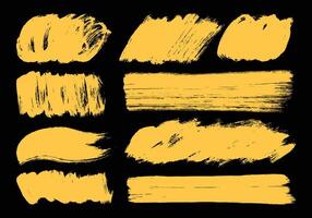 Abstract yellow paint brushes element set. Hand drawn ink smear and smudge. Creative artwork elements. vector