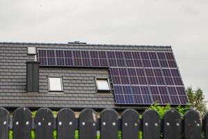 House roof with photovoltaic modules. photo