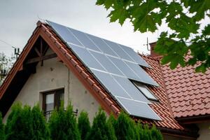 House roof with photovoltaic modules. photo