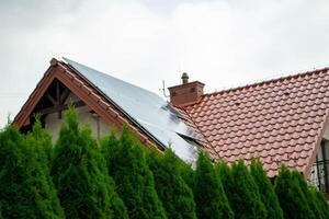 House roof with photovoltaic modules. photo