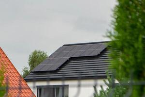 House roof with photovoltaic modules. photo
