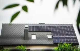 House roof with photovoltaic modules. photo
