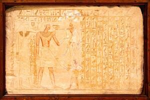 Old Egyptian hieroglyphs on an ancient background. photo