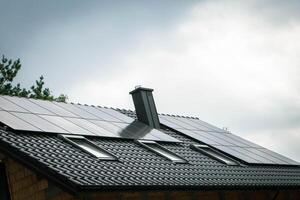 House roof with photovoltaic modules. photo