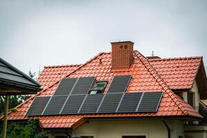 House roof with photovoltaic modules. photo