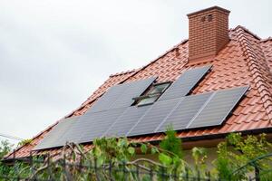 House roof with photovoltaic modules. photo