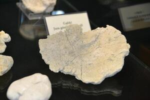 a large rock with a hole in it is floating in the air photo