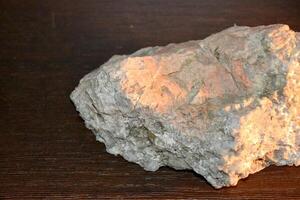 a large rock with a hole in it is floating in the air photo