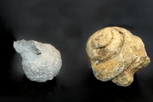 a large rock with a hole in it is floating in the air photo