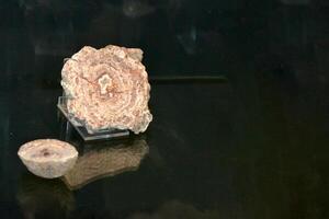 a large rock with a hole in it is floating in the air photo