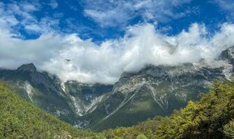 The Jade Dragon Snow Mountain, a towering, beautiful mountain range. photo
