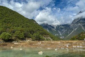 The Jade Dragon Snow Mountain, a towering, beautiful mountain range. photo