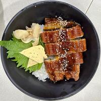 Delicious eel rice bowl in the evening photo