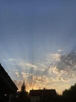 Clouds at sunset on a hot summer day photo