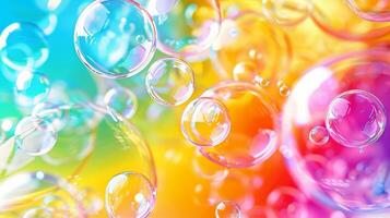 Vibrant colorful soap bubbles on a rainbow gradient background. Concept of bubbles, colors, fun, playful atmosphere. Copy space photo