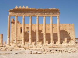 The Bel Temple in Palmyra, Syria, is an ancient architectural marvel. Majestic columns and intricate carvings adorn its facade, reflecting a blend of Roman and Semitic influences. The temple, dedicate photo