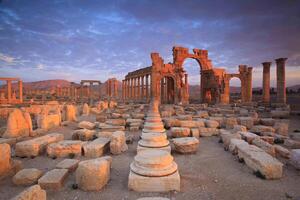 The Bel Temple in Palmyra, Syria, is an ancient architectural marvel. Majestic columns and intricate carvings adorn its facade, reflecting a blend of Roman and Semitic influences. The temple, dedicate photo