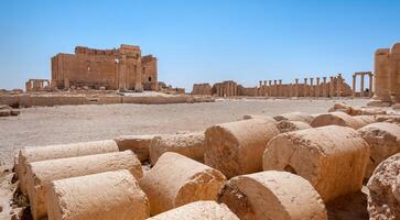 The Bel Temple in Palmyra, Syria, is an ancient architectural marvel. Majestic columns and intricate carvings adorn its facade, reflecting a blend of Roman and Semitic influences. The temple, dedicate photo