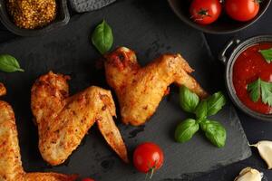 Fried chicken wings. Delicious food with fried chicken photo