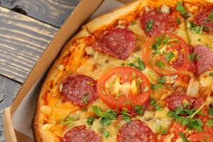 pizza in box open. Pizza in the in delivery box photo