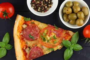 Sliced pizza on the table in the restaurant. Italian pizza on wooden table background photo