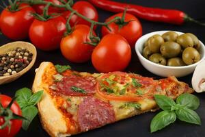 Sliced pizza with vegetables. Pizza on the table photo