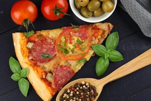 Sliced pizza with vegetables. Pizza on the table photo