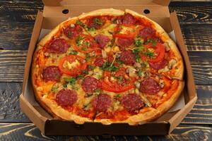 pizza in box open. Pizza in the in delivery box photo