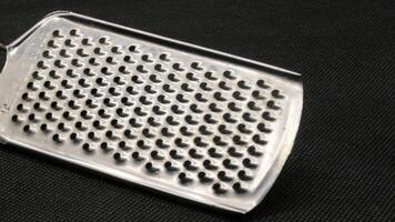 Small metal cheese grater isolated photo