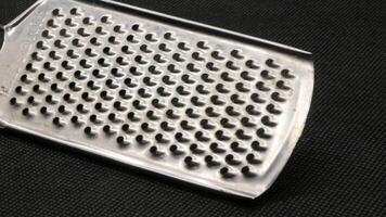 Small metal cheese grater isolated photo