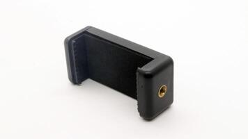 Tripod U holder for smart phone and camera isolated photo