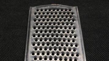 Small metal cheese grater isolated photo